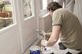 A sydney house painter, painting windows and doors.